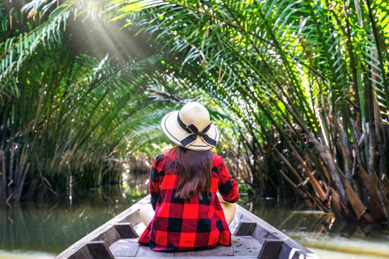 asian-women-sitting-boat-tunnel